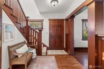 Original stained millwork welcomes you in, instantly creating that warm, feeling these timeless Craftsman homes are known for.