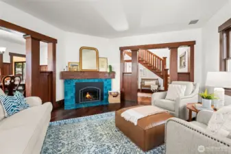 The homeowners have honored the home’s original character, preserved the millwork and thoughtfully added modern updates like this stunning fireplace with a warm gas insert.