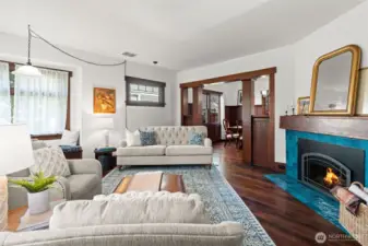 Filled with natural light, this room feels easy and inviting with tall ceilings, a cozy corner window seat, and original leaded glass adding just the right touch of character.