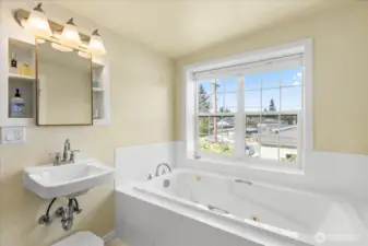 Primary bath with soaking tub and separate shower.