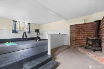 Back half of the detached garage with 408 SF flex space and wood burning stove!