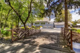 Cross over Garrison Creek to this Unique Property
