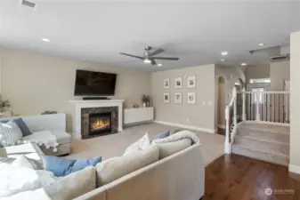 Spacious and welcoming family room. Gas fireplace flanked by white cabinetry.