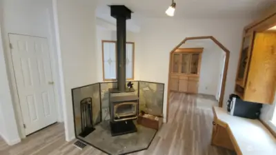 Nice wood burning fire place in the kitchen/family room area.