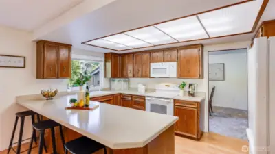 Breakfast bar seating, great for a quick bite or easy gathering while prepping meals.