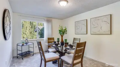 This spacious dining room offers brand new carpets and views to the private backyard.