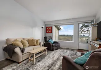 Living room has ample space for guests and fun.  Vaulted ceilings are icing on the cake.