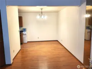 Dining room is next to a kitchen
