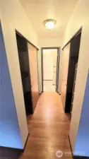 His and hers closet in primary bedroom