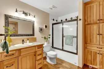 2nd floor full bathroom with lots of storage and beautiful cabinets and flooring. Located at the top of the stairs first door on the left.