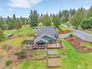 The previous owners had a above ground swimming pool on the flat area in this photo.