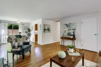 All three bedrooms are down the hall to the Right...Dining room is straight ahead, and the kitchen is open to the dining room. Easy access to the yard creates flow that's excellent for entertaining!