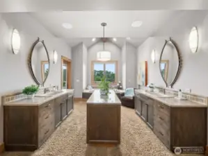 Primary bathroom has his and hers private toilet rooms, heated floors, and a personal patio