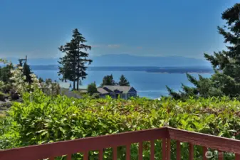 View of the Olympics and Shipping Lanes from your front deck which wraps around the entire west and south side of your home.