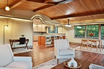 Looking back at the kitchen which has been opened up to maximize your view. Generous placement of windows continues throughout this home.
