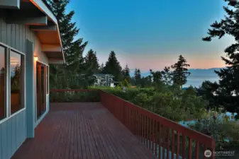 Invite your family & friends! Plenty of space to entertain. Expand your living to the expansive decks that surround the south, west and northern sides of your home. The surrounding landscape provides privacy here.