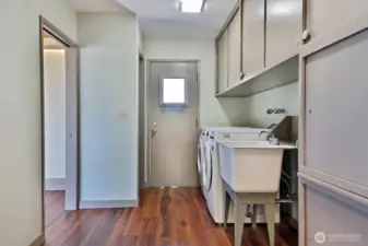 Laundry Room & Pantry are adjacent to the Kitchen and the door leads to your back deck and backyard.