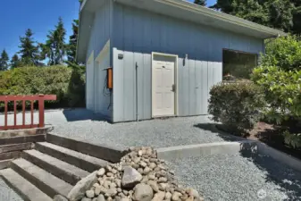 You have stepped outside the Primary/Guest Suite. Plenty of height if you want to make this into indoor RV parking. Or keep it in its shop form.