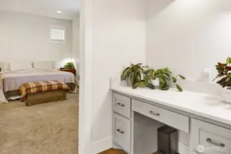 Just off the kitchen, a custom desk and storage area provides the perfect spot for homework, managing bills, or working on the computer.
