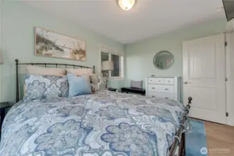 Bedroom with deck and access to hot tub on the main floor.