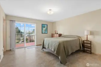 The Main floor ~ Primary suite/Bedroom #3 w/ more views & a slider off to the deck.