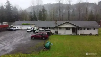 Enjoy waterfront living on a large lot and run your home business.