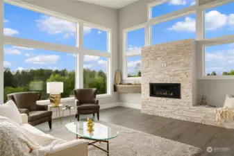 Main Floor Open Great Room • Stone Wrapped Gas Fireplace • Energy Efficient Vinyl Windows with Views of River & Park