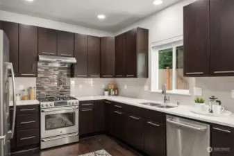 Kitchen with stainless appliances and quartz counters