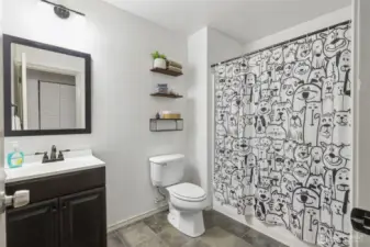 Hall bath with lovely tile flooring
