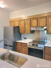 New stainless stove, range hood, refrigerator and dishwasher