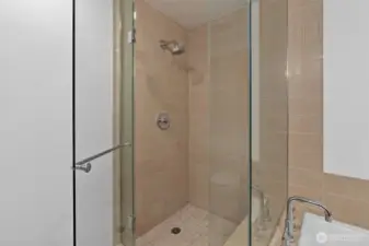 Separate enclosed shower.