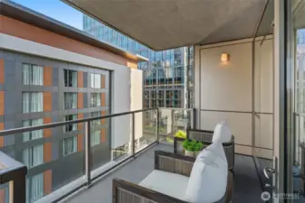 Large balcony accessible from living area and bedroom.