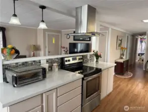 New laminate flooring, professional vent, quartz counters, newer appliances