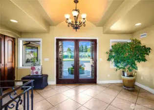 Beautiful tile floors set the tone in the spacious front entry—offering a warm welcome with timeless appeal.