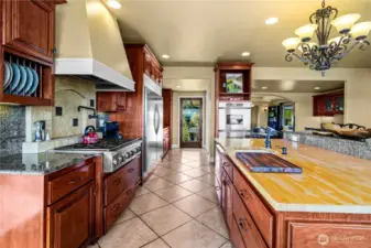 Cook and entertain in style in this gorgeous kitchen with upscale features and panoramic views that brighten the space.