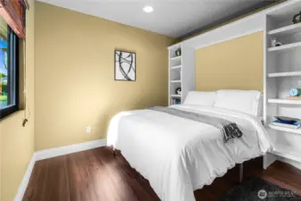 Second upstairs bedroom with built ins.