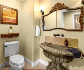 Upstairs guest bath showcases a unique, oversized sink—adding character and functionality to this well-appointed space.