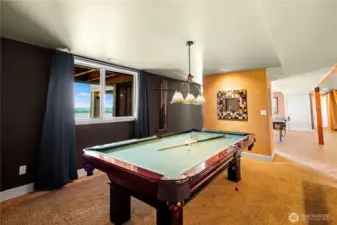 Enjoy endless fun in the dedicated game room complete with a pool table, ideal for family gatherings and socializing.