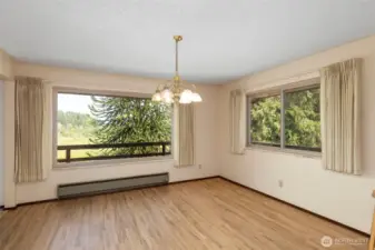 Room for the largest of dinning tables and accent furniture. Windows flood the room with light and allow enjoyment of the views.