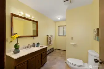 The main floor bathroom has full tub and shower and large vanity.