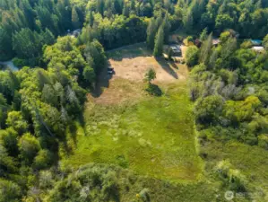 The house is nestled in the upper corner, leaving the rest of the property open.
