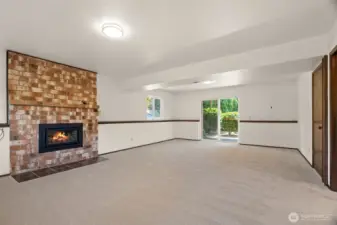 Lower level family room with fireplace.