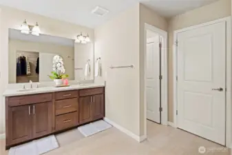 Double vanity next to water closet