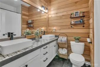 Full main bath with dual vanity and stylish fixtures