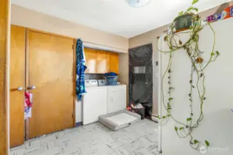 Utility area with washer/dryer hookups and extra storage