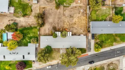 Spacious lot with mature trees and fenced backyard.