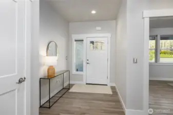 No-step entry from a deep covered patio off the private driveway.