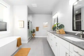 Primary suite bath with tile heated tile flooring, a deep, relaxing soaking tub, separate shower, huge double vanity.
