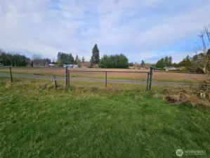 Large 12' gate with easy access off neighboring road.