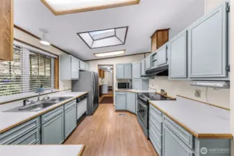 Very nice kitchen ready for you!  New range/stove on your right.